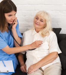 nurse-checking-old-woman-with-her-stethoscope